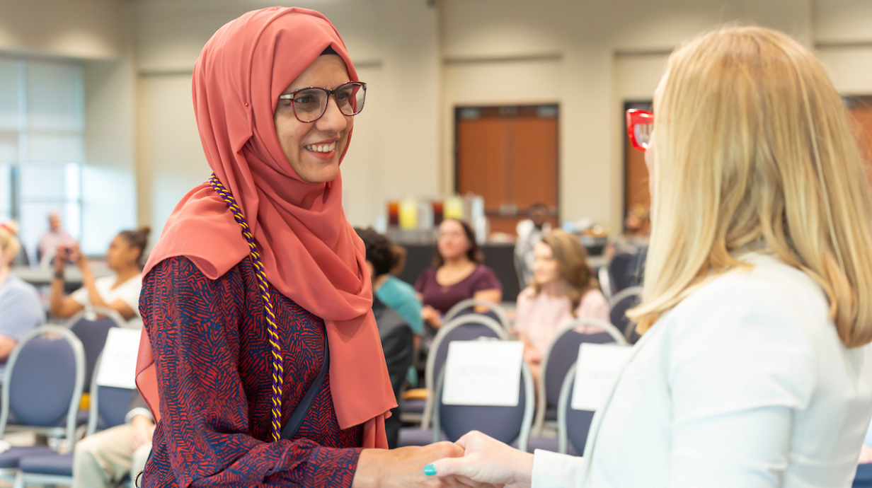Student shaking hands with Dean of Graduate School.