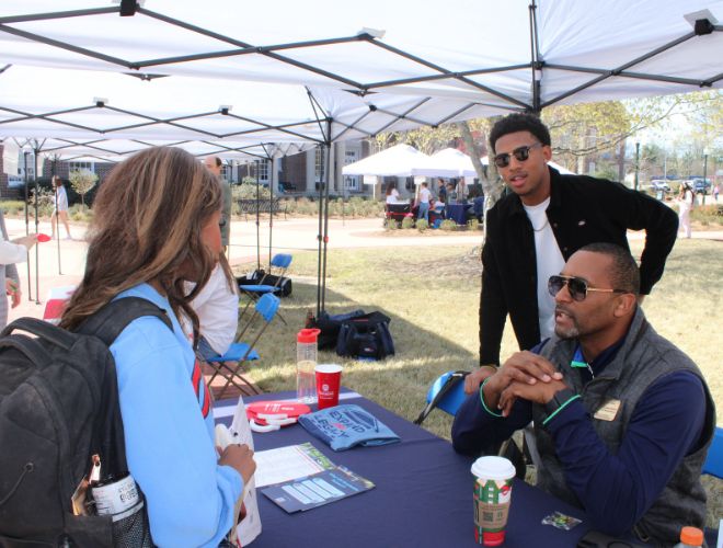Dr. Gilner and student discussing Graduate School at the Spring Refresher.