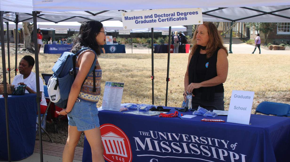 Dr. Spiroff and student discussing Graduate School at the Spring Refresher.