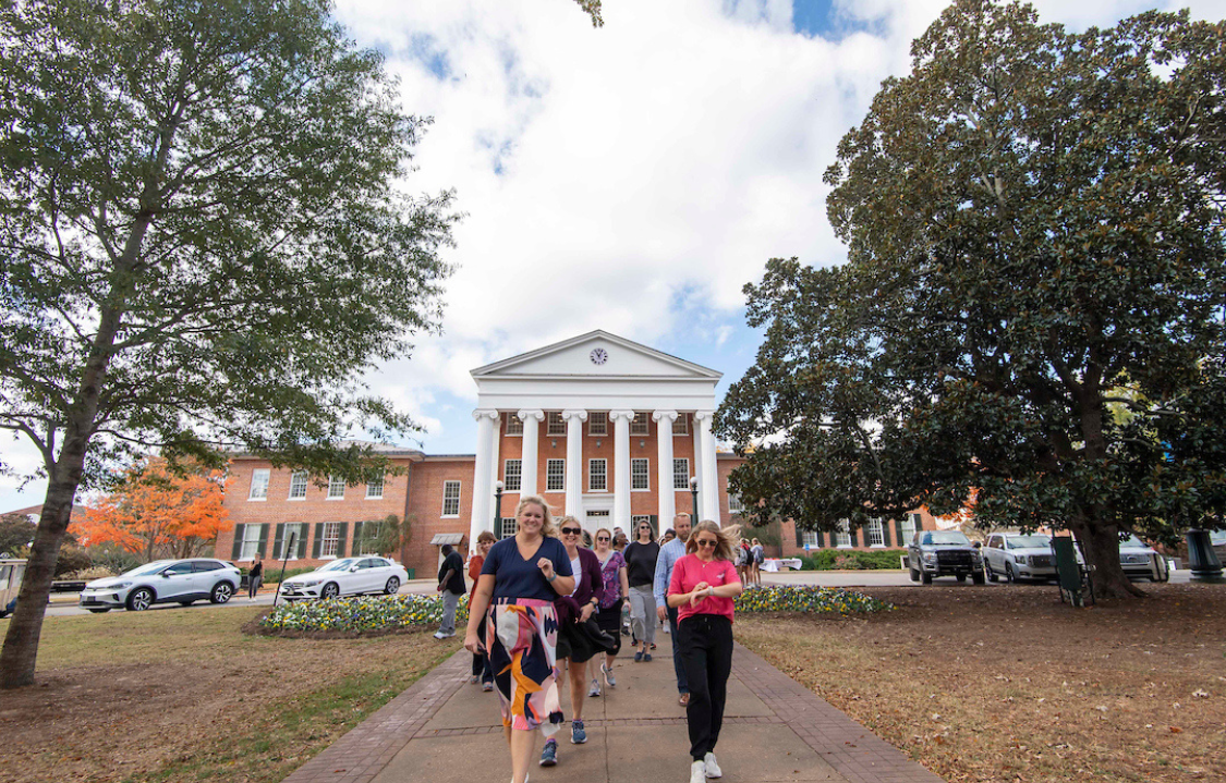 Faculty and students walking in front of the Lyceum.