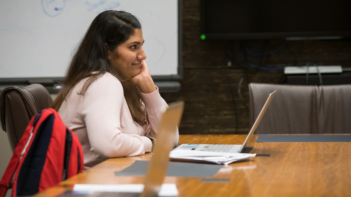 Student in class on her laptop