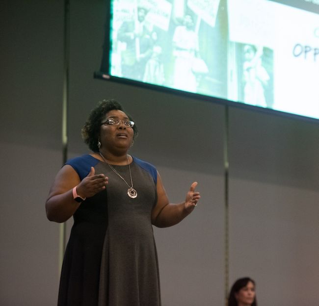 A graduate student competes in the three minute thesis.