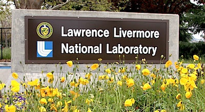 Lawrence Livermore National Laboratory sign with yellow flowers