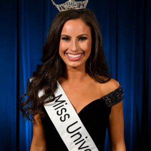 Miss University with her crown and sash